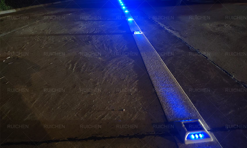 Blue Solar Road Stud On The Centerline Of The Road